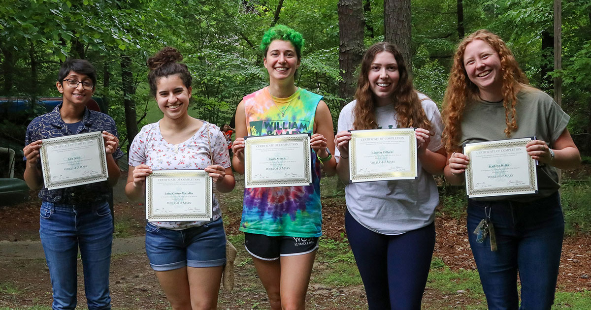 W&M undergraduates Anu Desai, Luisa Castro-Mierelles, Emily Morris, Lindsey Dillard and Kathryn Keller pose with their Minor in Marine Science certificates during a celebratory cookout. Photo by John Wallace.