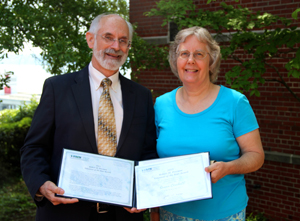 Susan Crockett (right) and VIMS Dean and Director John Wells (left).